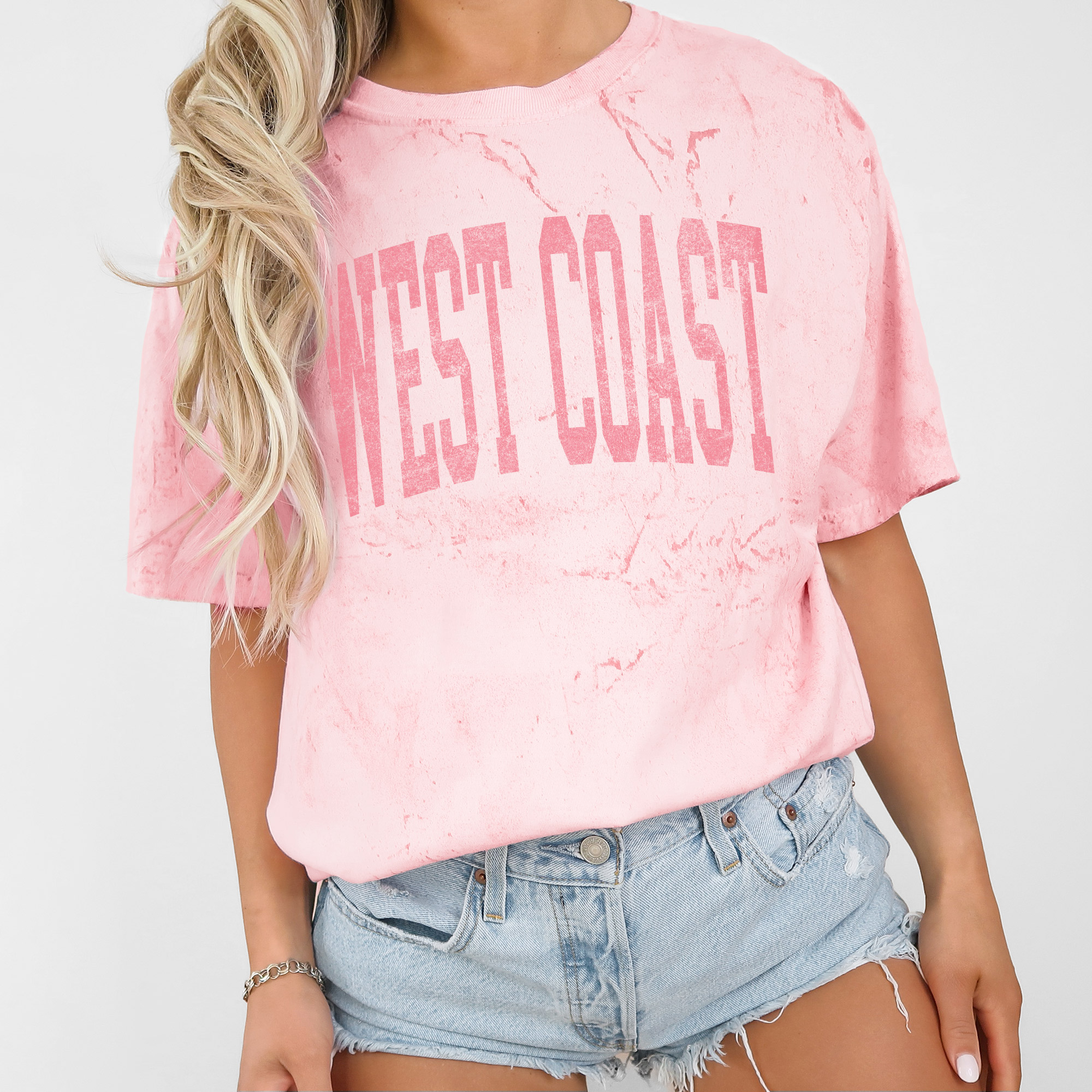 Woman wearing a light pink t-shirt.