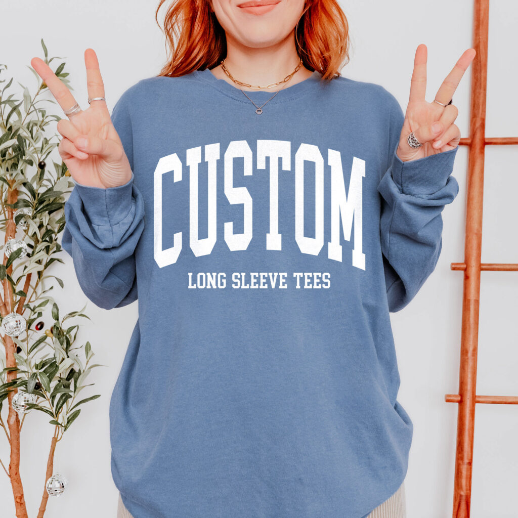 woman wearing blue custom long sleeve t-shirt.