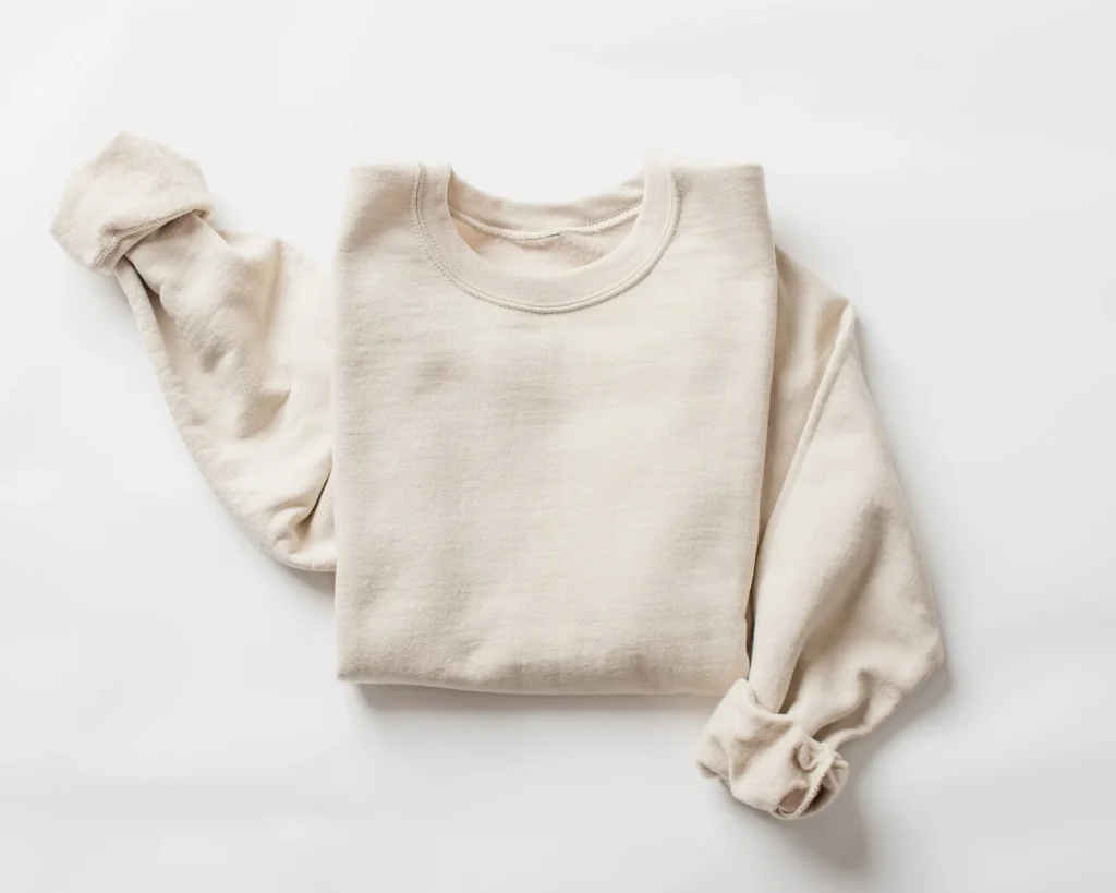 Flat lay of a cream colored sweatshirt.