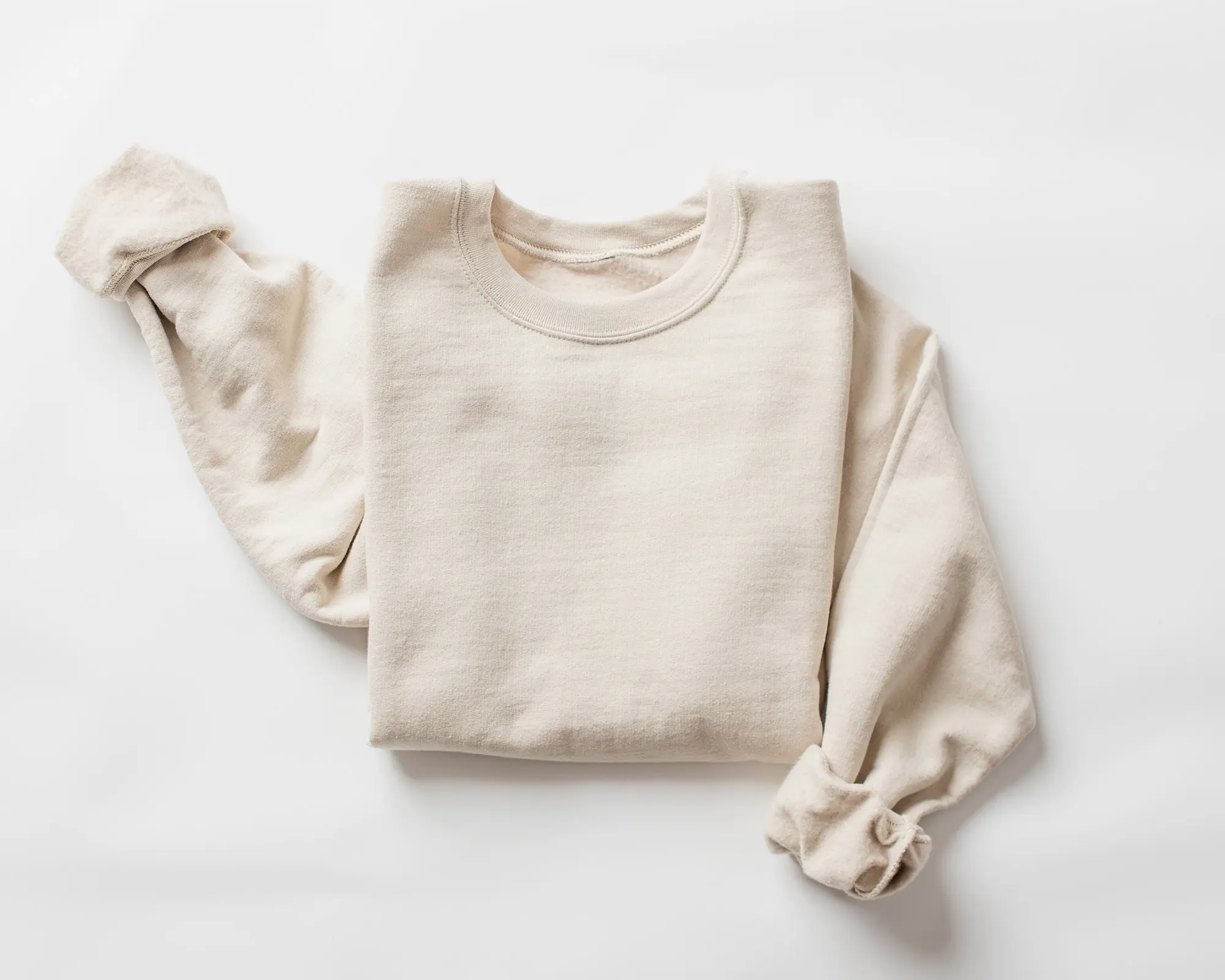 Flat lay of a cream colored sweatshirt.