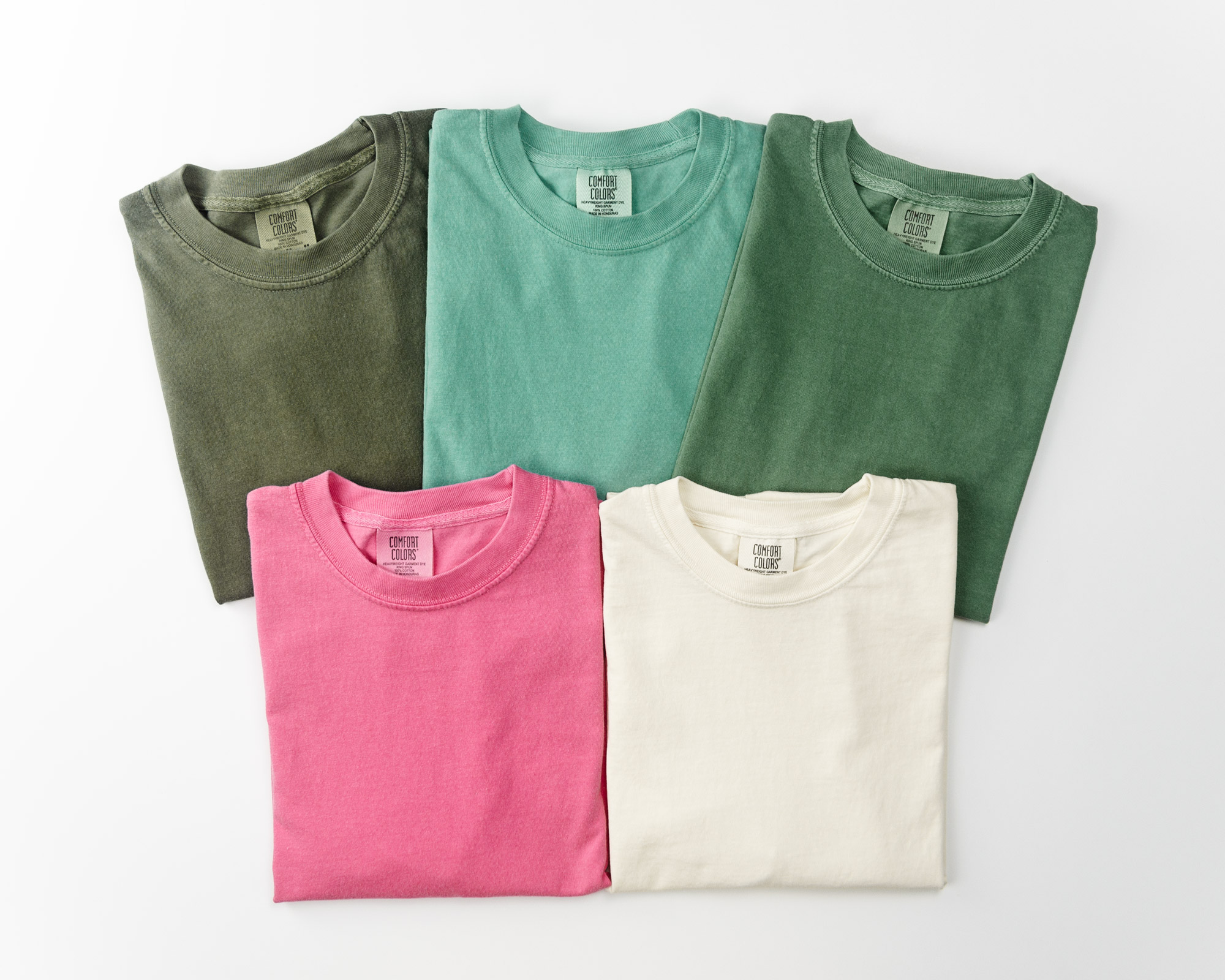 Flat lay of five t-shirts.