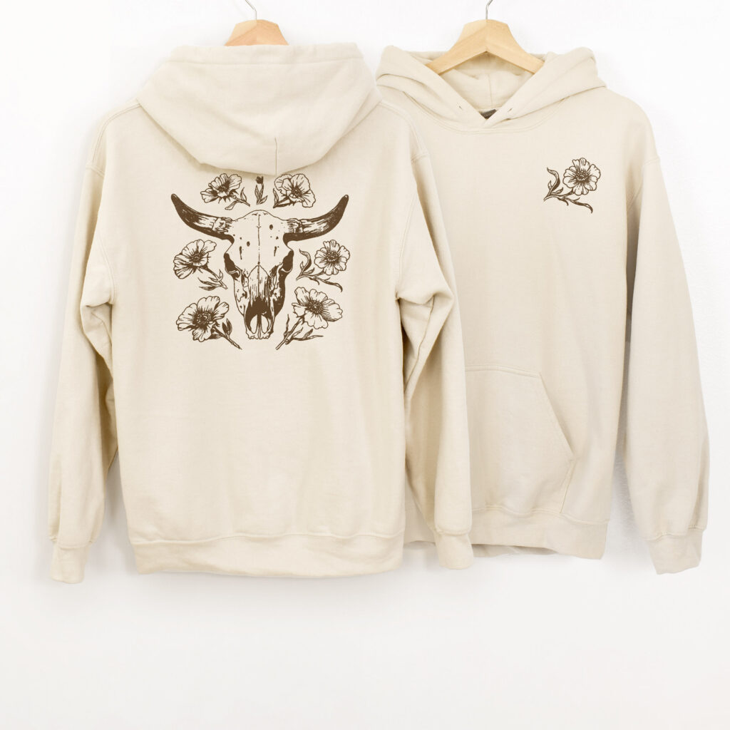 Hoodie flat lay with showing front and back with a country cowgirl design on it.